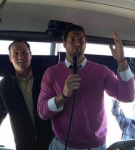 Tim Tebow addresses the Wichita State University men’s basketball team. Coach Gregg Marshall looks on. Photo by Kellen Marshall