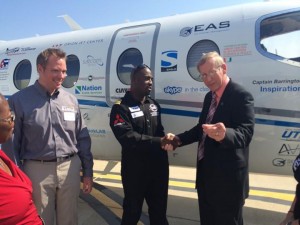 KDOT Division of Aviation Marketing Manager Nathaniel Hinkel and its Deputy Director George Laliberte with Captain Barrington Irving (center).