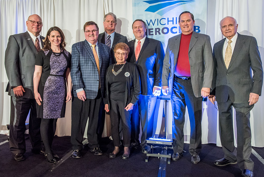 Pictured left to right: Dave Franson, Wichita Aero Club president; Ashley Bowen Cook, Wichita Aero Club board member and gala chair; Mike King, Kansas Secretary of Transportation; Jeff Peier, Wichita Aero Club chairman; Connie Palacioz, Doc volunteer and an original Rosie the Riveter; Mike Pompeo, Kansas Fourth District congressman; Jim Murphy, Doc volunteer and project director; and Tony Mazzolini, Doc’s most ardent champion.