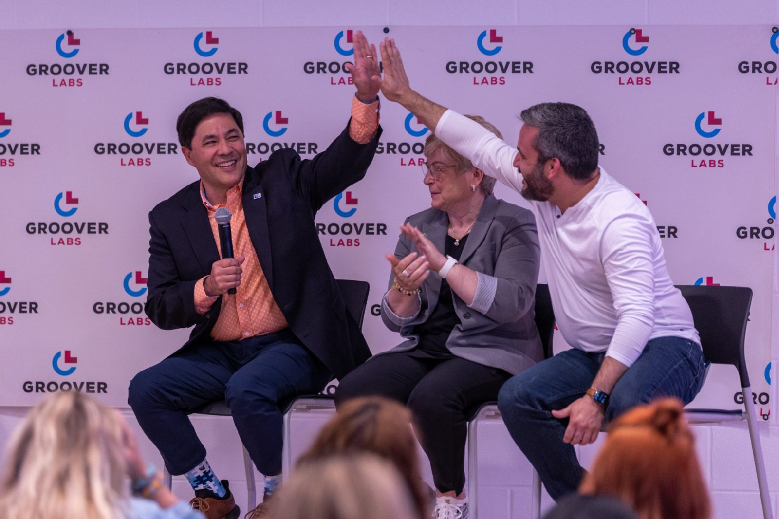 Members of the Social Media Day Wichita panel give each other a high-five as they agree on a powerful topic.